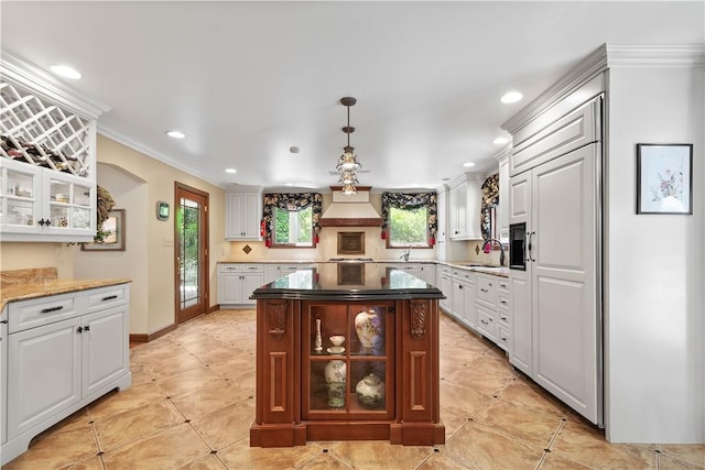 2590 Wildwood Rd, Hampton, PA 15101 - kitchen featuring crown molding, glass insert cabinets, recessed lighting, custom range hood, and white cabinets