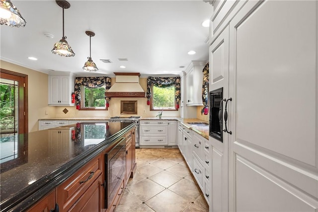 2590 Wildwood Rd, Hampton, PA 15101 - kitchen featuring custom range hood, stainless steel stove, white cabinetry, wine cooler, and recessed lighting