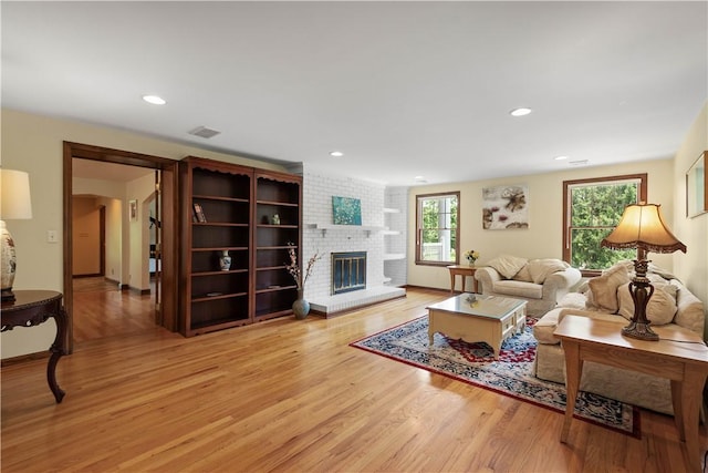 2590 Wildwood Rd, Hampton, PA 15101 - living area with light wood-style floors, a fireplace, and recessed lighting