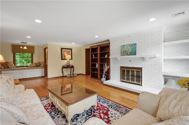 2590 Wildwood Rd, Hampton, PA 15101 - living room featuring a fireplace, wood finished floors, and recessed lighting
