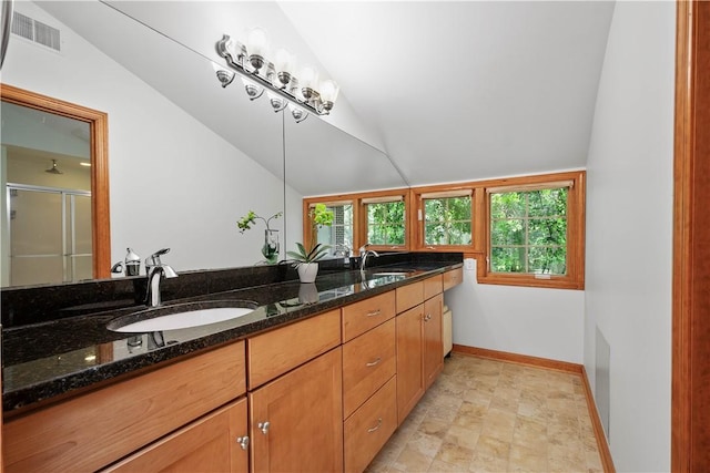 2590 Wildwood Rd, Hampton, PA 15101 - full bath featuring vaulted ceiling, double vanity, a stall shower, and stone finish floors