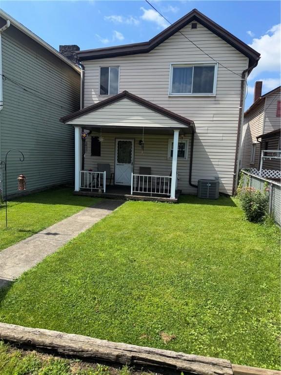33 Spruce St, Natrona, PA 15065 - traditional-style home with a porch