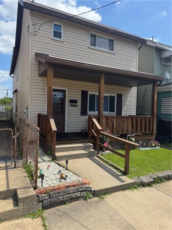 33 Spruce St, Natrona, PA 15065 - view of front of home featuring a porch and a gate