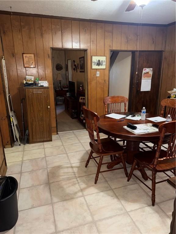 33 Spruce St, Natrona, PA 15065 - dining area featuring wood walls and a ceiling fan