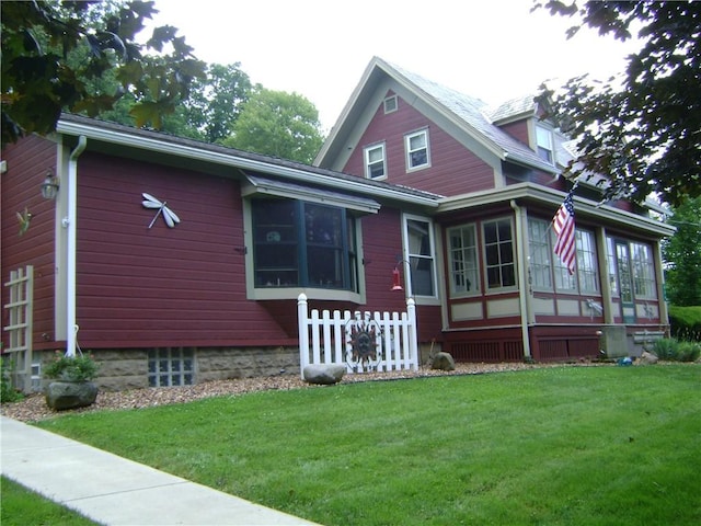 404 Scipio, Jamestown, PA 16134 - view of front facade featuring a sunroom and a front lawn