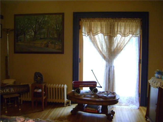 404 Scipio, Jamestown, PA 16134 - sitting room with healthy amount of natural light, wood finished floors, and radiator
