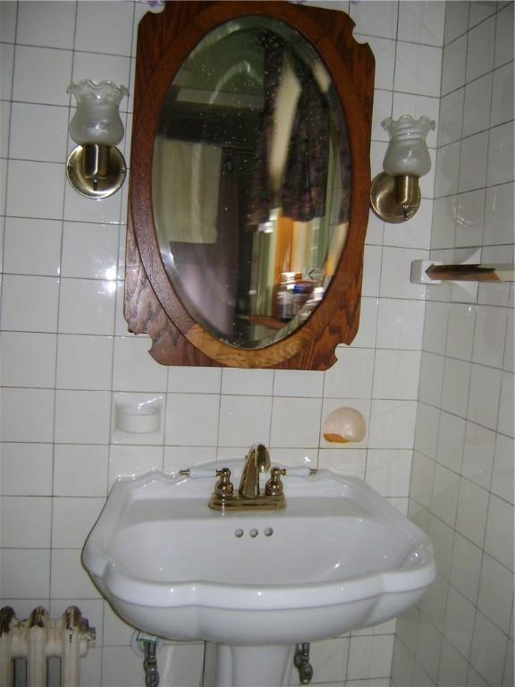 404 Scipio, Jamestown, PA 16134 - bathroom featuring tile walls and radiator heating unit