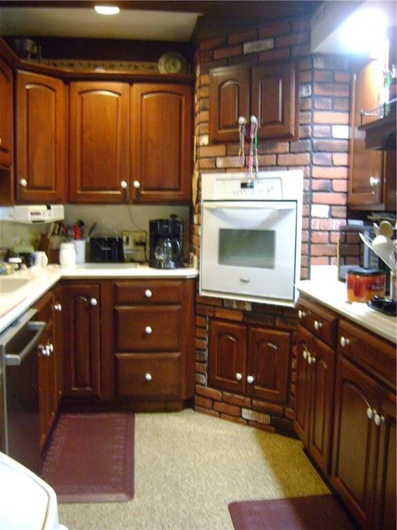 404 Scipio, Jamestown, PA 16134 - kitchen with white oven, light countertops, stainless steel dishwasher, and light colored carpet
