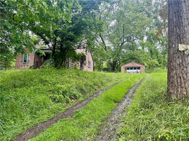 263 Elicker Rd, Plum Boro, PA 15239 - view of yard featuring a detached garage and an outbuilding