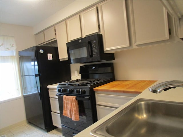 43 Shadow, Whitehall, PA 15227 - kitchen featuring black appliances and light tile patterned floors