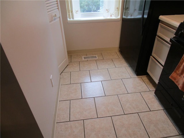 43 Shadow, Whitehall, PA 15227 - kitchen featuring light tile patterned floors and white stove