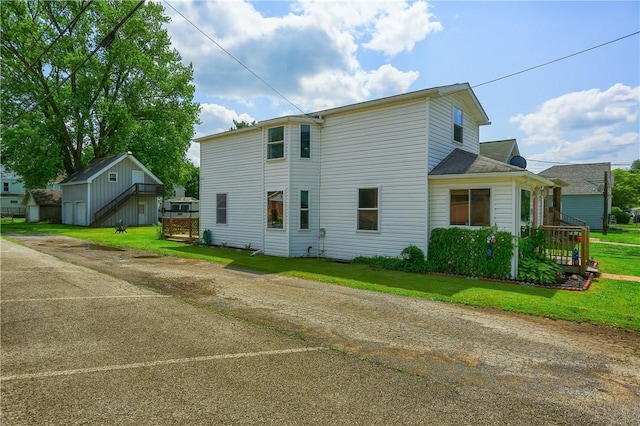 516 5th St, Darlngtn Twp, PA 16115 - rear view of property with driveway and a lawn