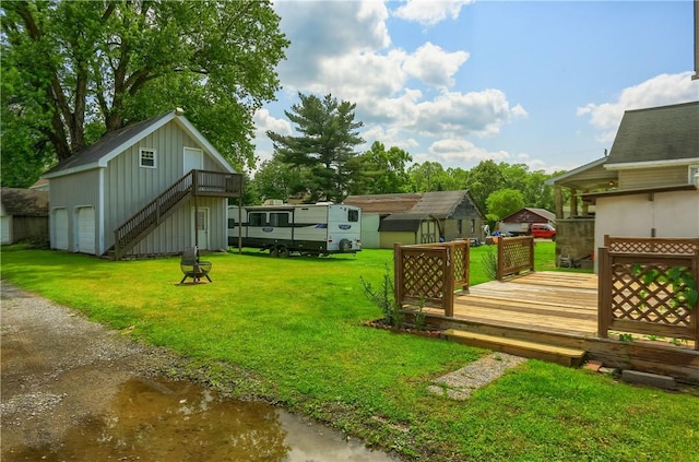 516 5th St, Darlngtn Twp, PA 16115 - view of green lawn featuring a deck, stairway, and an outbuilding
