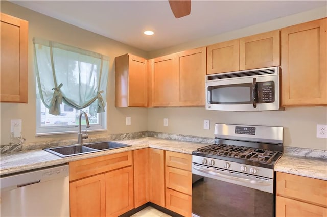 516 5th St, Darlngtn Twp, PA 16115 - kitchen with appliances with stainless steel finishes, light brown cabinets, light countertops, and recessed lighting