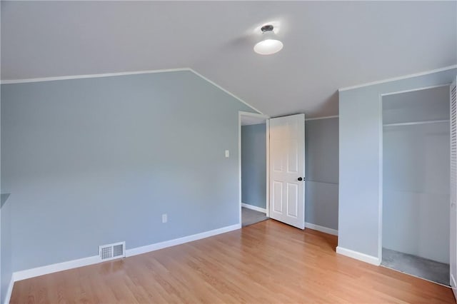 516 5th St, Darlngtn Twp, PA 16115 - unfurnished bedroom featuring vaulted ceiling, wood finished floors, and a closet