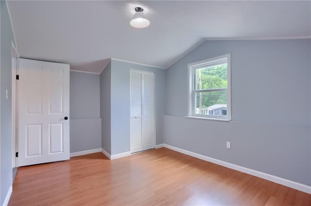 516 5th St, Darlngtn Twp, PA 16115 - unfurnished bedroom with light wood finished floors, a closet, and lofted ceiling