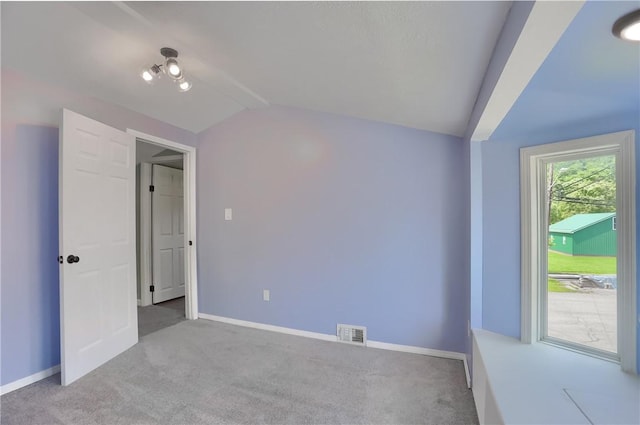 516 5th St, Darlngtn Twp, PA 16115 - unfurnished bedroom featuring vaulted ceiling and carpet