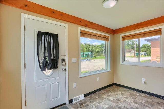 516 5th St, Darlngtn Twp, PA 16115 - foyer with healthy amount of natural light and stone finish flooring