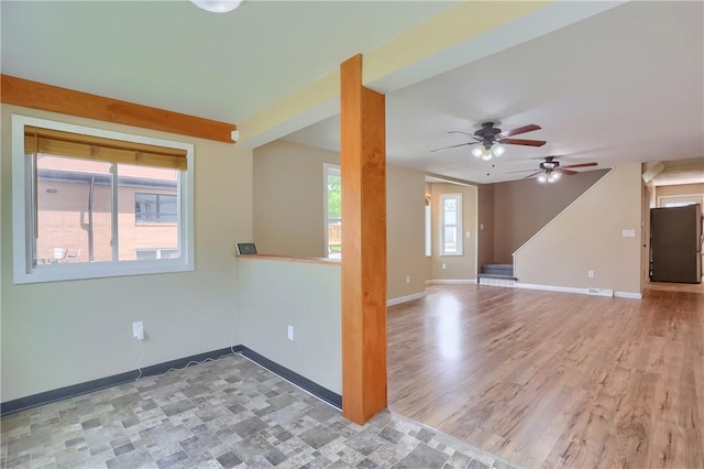 516 5th St, Darlngtn Twp, PA 16115 - unfurnished living room featuring ceiling fan and light wood-type flooring