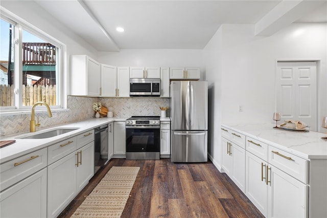 211 Taylor St, Bloomfield, PA 15224 - kitchen with stainless steel appliances, backsplash, dark wood-type flooring, light stone countertops, and recessed lighting