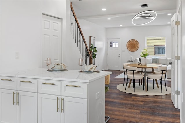 211 Taylor St, Bloomfield, PA 15224 - kitchen featuring dark wood finished floors, white cabinets, light stone countertops, and recessed lighting