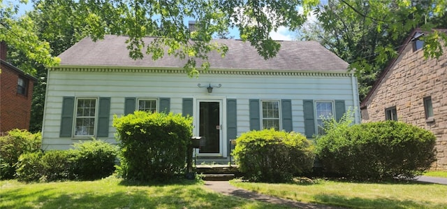 69 Princeton Ave, Uniontown, PA 15401 - view of front facade featuring a front lawn, a chimney, and a shingled roof