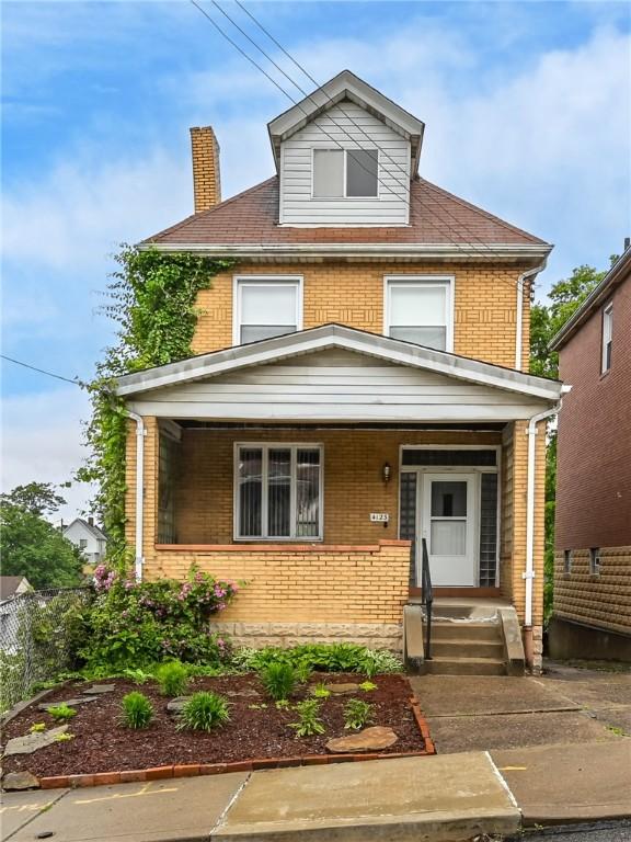 4123 Stanley St, Greenfield, PA 15207 - american foursquare style home featuring brick siding, a chimney, and covered porch