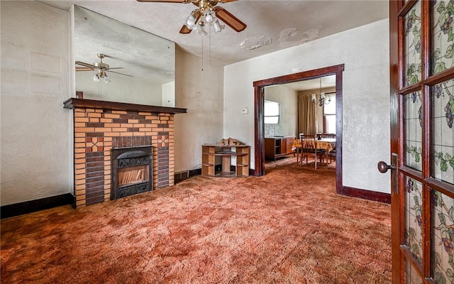 4123 Stanley St, Greenfield, PA 15207 - living area featuring carpet, a ceiling fan, a textured wall, and a fireplace