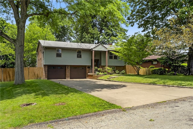 1171 La Salle Rd, Monroeville, PA 15146 - split foyer home with brick siding, a garage, and concrete driveway