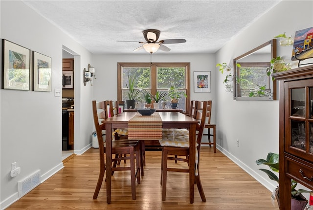1171 La Salle Rd, Monroeville, PA 15146 - dining area featuring ceiling fan, light wood finished floors, and a textured ceiling