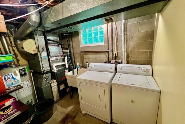 1171 La Salle Rd, Monroeville, PA 15146 - laundry room featuring washer and dryer and gas water heater