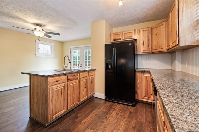 2072 Dartmore St, Overbrook, PA 15210 - kitchen with black fridge with ice dispenser, a peninsula, dark wood-style flooring, a textured ceiling, and a ceiling fan