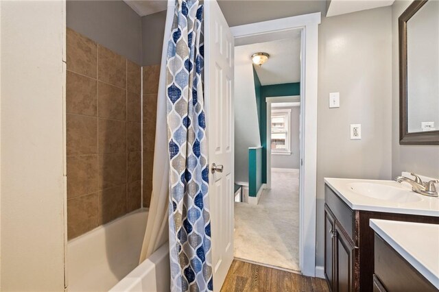 2072 Dartmore St, Overbrook, PA 15210 - full bathroom featuring vanity, wood finished floors, and shower / tub combo