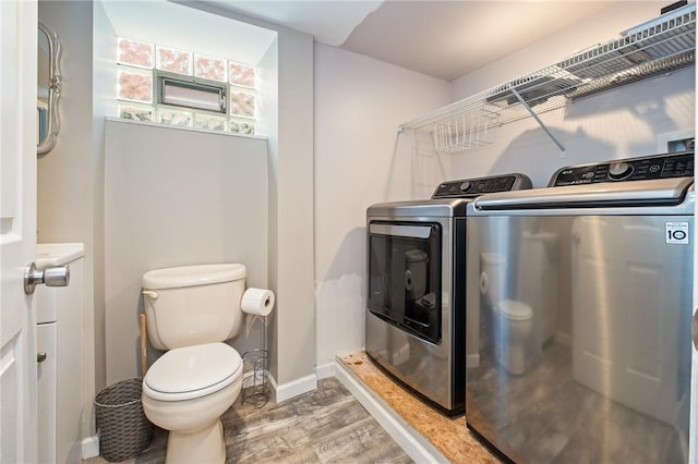 2072 Dartmore St, Overbrook, PA 15210 - bathroom featuring washer and dryer and wood finished floors