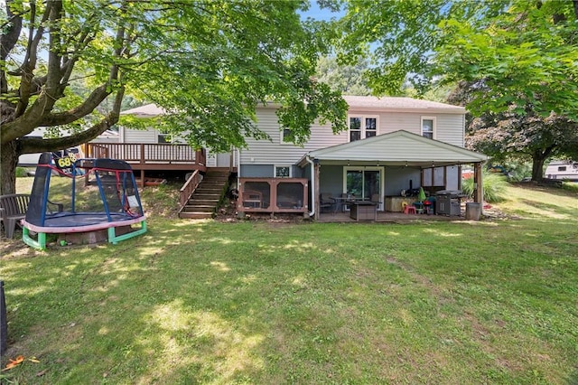 2180 Dime Rd, Bethel Twp, PA 15690 - rear view of property with a trampoline, a yard, a deck, and a patio area