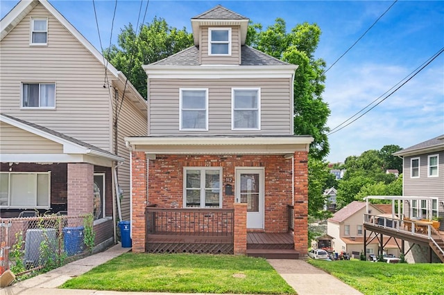 312 Edith St, Mt Washington, PA 15211 - traditional style home with brick siding, a porch, and a shingled roof