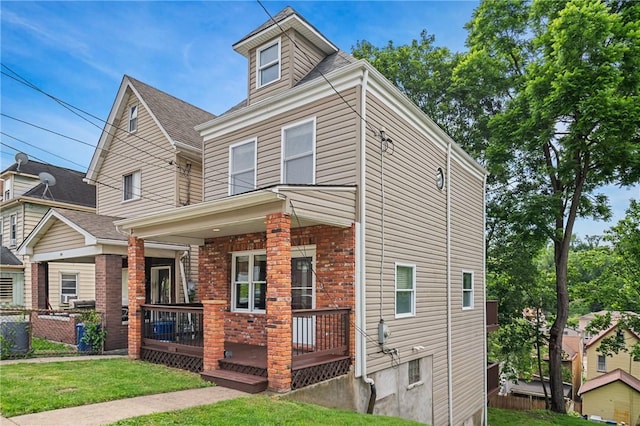 312 Edith St, Mt Washington, PA 15211 - traditional style home featuring a shingled roof and covered porch