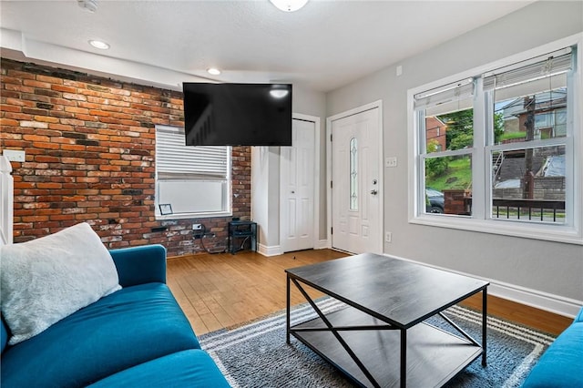 312 Edith St, Mt Washington, PA 15211 - living room featuring brick wall, wood finished floors, and recessed lighting