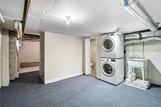 312 Edith St, Mt Washington, PA 15211 - washroom featuring stacked washer / drying machine and carpet flooring
