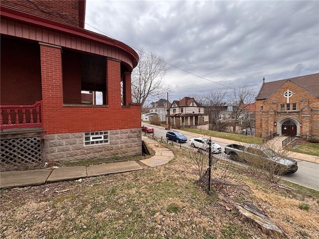 26 Carrick Ave, Carrick, PA 15210 - view of side of home featuring brick siding and a residential view