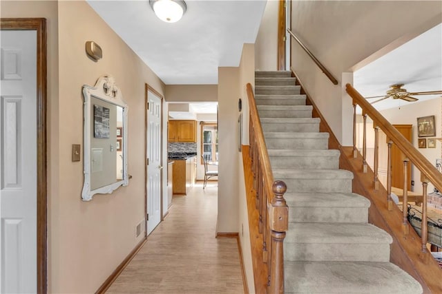 116 Rizzi Dr, Penn Twp Wml, PA 15642 - stairway featuring wood finished floors and a ceiling fan