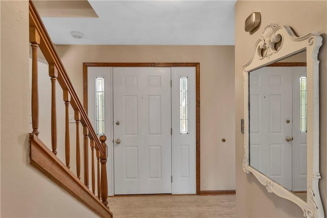 116 Rizzi Dr, Penn Twp Wml, PA 15642 - foyer with plenty of natural light, light wood-style flooring, and stairway