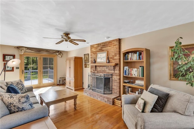 116 Rizzi Dr, Penn Twp Wml, PA 15642 - living area featuring a fireplace, light wood-style floors, and ceiling fan