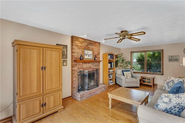 116 Rizzi Dr, Penn Twp Wml, PA 15642 - living area featuring a brick fireplace, a ceiling fan, and light wood-style flooring
