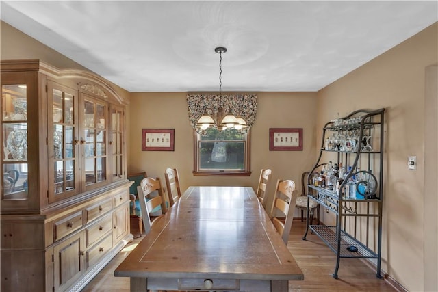 116 Rizzi Dr, Penn Twp Wml, PA 15642 - dining space with wood finished floors, healthy amount of natural light, and a chandelier