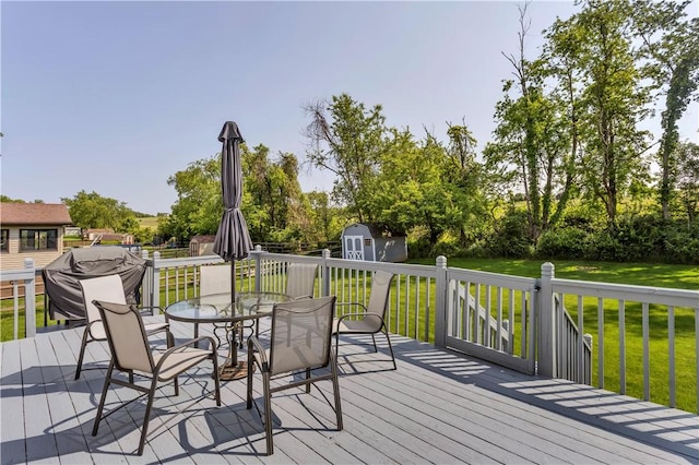 116 Rizzi Dr, Penn Twp Wml, PA 15642 - wooden terrace with a shed, outdoor dining space, and a lawn