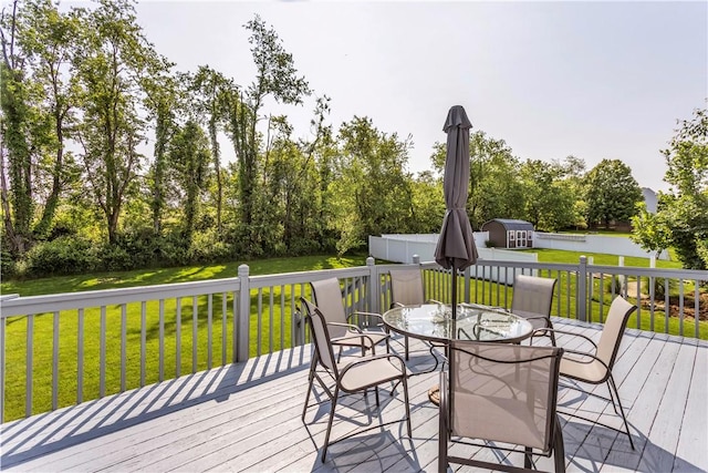116 Rizzi Dr, Penn Twp Wml, PA 15642 - deck featuring a yard, outdoor dining area, and view of scattered trees