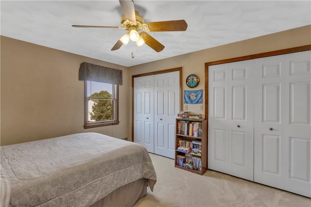 116 Rizzi Dr, Penn Twp Wml, PA 15642 - bedroom featuring two closets, light carpet, and ceiling fan