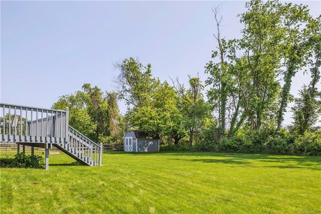 116 Rizzi Dr, Penn Twp Wml, PA 15642 - view of grassy yard featuring a shed, stairway, and a deck