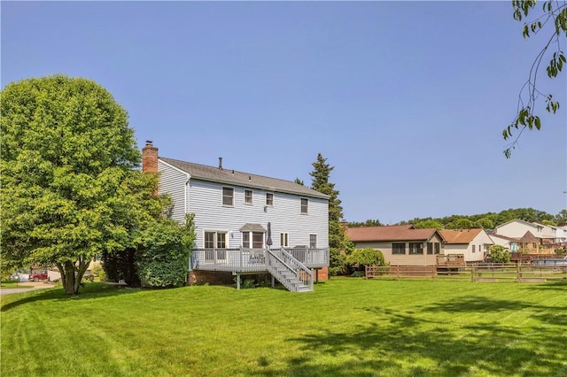 116 Rizzi Dr, Penn Twp Wml, PA 15642 - rear view of house with a deck, stairs, and a chimney